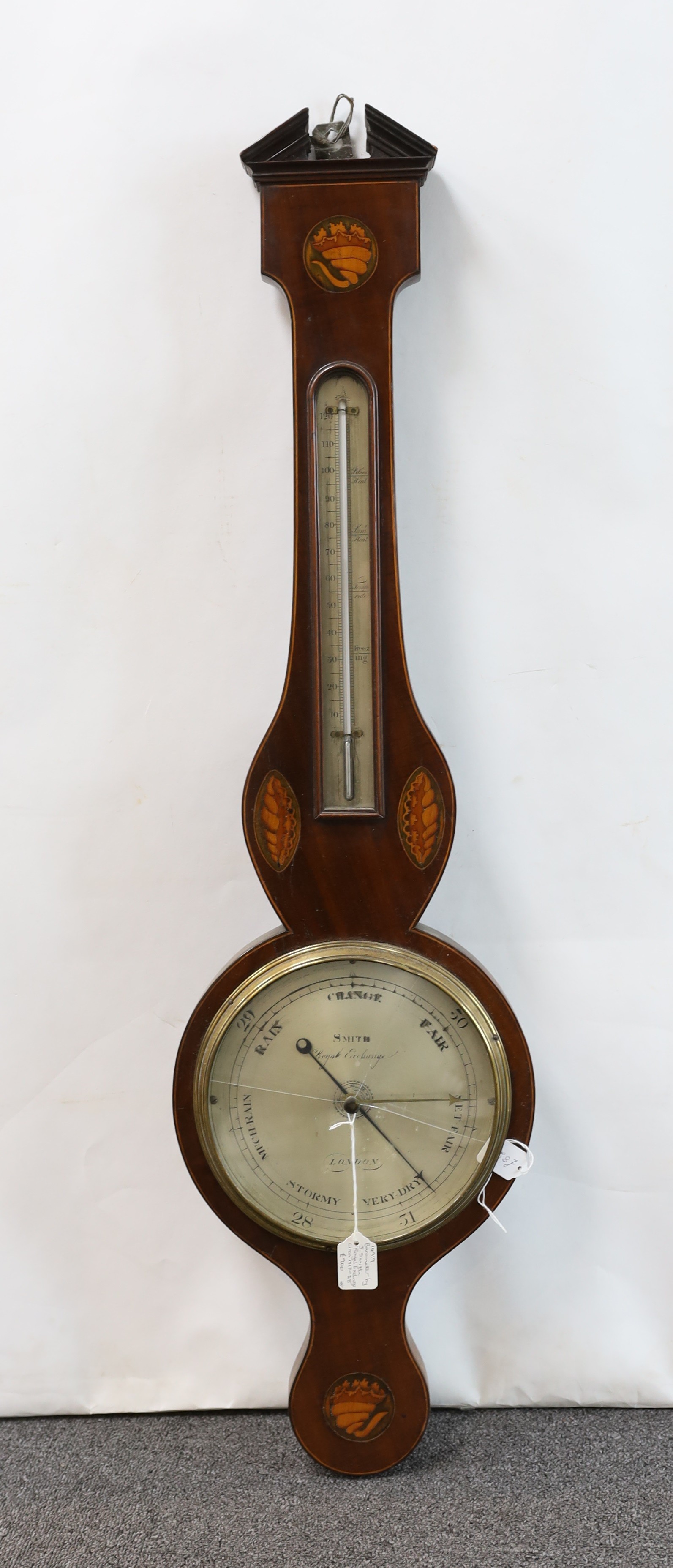 A George III inlaid mahogany wheel barometer and thermometer, the silvered dial marked Smith, Royal Exchange, London, height 98cm